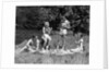 1930s Two Couples Having Summer Picnic With Food And Drink Spread Out On Blanket The Tip Of A Canoe Is Visible by Anonymous