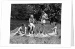 1930s Two Couples Having Summer Picnic With Food And Drink Spread Out On Blanket The Tip Of A Canoe Is Visible by Anonymous