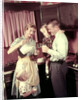 1950s Family In Kitchen Mother Pouring Milk From Pitcher For Dad And Kids by Anonymous