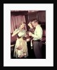 1950s Family In Kitchen Mother Pouring Milk From Pitcher For Dad And Kids by Anonymous