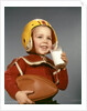 1950s 1960s Boy Drinking Glass Milk Wearing Football Helmet Shoulder Pads by Anonymous