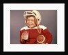 1950s 1960s Boy Drinking Milk Wearing Football Helmet Red Jersey Holding Ball by Anonymous