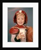 1960s Boy Wearing Red Helmet Football Shoulder Pads Holding Glass Milk and Football by Anonymous
