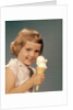 1950s 1960s Girl Eating Ice Cream Cone Double Scoop Vanilla by Anonymous