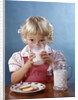 1950s 1960s Girl Drinking Milk Plate Cookies by Anonymous