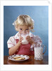 1950s 1960s Girl Drinking Milk Plate Cookies by Anonymous