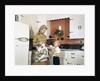 1970s Mother Handing Glass Of Milk To Son In Kitchen by Anonymous