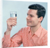 1960s Profile Man Wearing Red Checkered Shirt Holding Glass Of Water by Anonymous