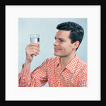 1960s Profile Man Wearing Red Checkered Shirt Holding Glass Of Water by Anonymous