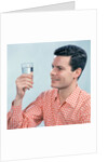 1960s Profile Man Wearing Red Checkered Shirt Holding Glass Of Water by Anonymous