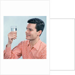 1960s Profile Man Wearing Red Checkered Shirt Holding Glass Of Water by Anonymous