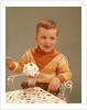 Boy Sitting At Ice Cream Parlor Table Eating Whipped Cream Cherry Topped Sundae+ by Anonymous