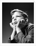 1940s Bored Serious Boy Waiting Chin Resting In Hands by Anonymous