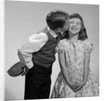 1950s 1960s Boy In Vest and Bow Tie Holding Valentine Candy Kissing Cheek Of Girl Making A Face by Anonymous