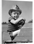 1940s Boy Playing Fireman In Toy Fire Truck Wearing Fireman's Safety Hat Holding Steering Wheel by Anonymous
