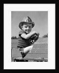 1940s Boy Playing Fireman In Toy Fire Truck Wearing Fireman's Safety Hat Holding Steering Wheel by Anonymous