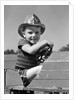 1940s Boy Playing Fireman In Toy Fire Truck Wearing Fireman's Safety Hat Holding Steering Wheel by Anonymous