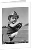 1940s Boy Playing Fireman In Toy Fire Truck Wearing Fireman's Safety Hat Holding Steering Wheel by Anonymous