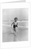1930s Little Toddler Running In Surf by Anonymous