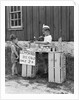 1930s 1940s Boy With Lemonade Stand Selling To Little Boy In Short Pants by Anonymous