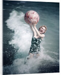 1950s Woman Jumping In Surf Holding Up Beach Ball by Anonymous