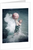 1950s Woman Jumping In Surf Holding Up Beach Ball by Anonymous