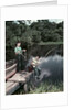 1950s Two Boys Fishing In Lake From Dock Outdoor by Anonymous