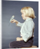 1950s 1960s Girl With Pet Bird Parakeet On Her Finger by Anonymous
