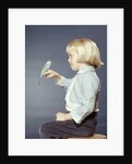 1950s 1960s Girl With Pet Bird Parakeet On Her Finger by Anonymous