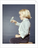 1950s 1960s Girl With Pet Bird Parakeet On Her Finger by Anonymous