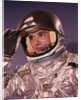 1960s Man Astronaut Lifting Up Visor Helmet Wearing Silver Navy Space Suit by Anonymous