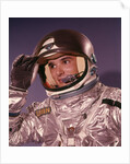 1960s Man Astronaut Lifting Up Visor Helmet Wearing Silver Navy Space Suit by Anonymous