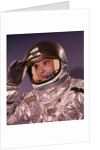 1960s Man Astronaut Lifting Up Visor Helmet Wearing Silver Navy Space Suit by Anonymous