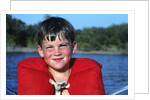 Young Boy Wearing Red Life Preserver by Anonymous