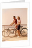 1950s 1960s Teen Couple Standing By Bikes On Beach Boardwalk by Anonymous