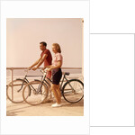 1950s 1960s Teen Couple Standing By Bikes On Beach Boardwalk by Anonymous