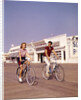 1950s Teen Couple Riding Bikes On The Boardwalk Jersey Shore by Anonymous