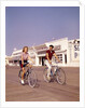 1950s Teen Couple Riding Bikes On The Boardwalk Jersey Shore by Anonymous