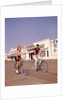1950s Teen Couple Riding Bikes On The Boardwalk Jersey Shore by Anonymous