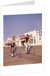 1950s Teen Couple Riding Bikes On The Boardwalk Jersey Shore by Anonymous