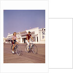 1950s Teen Couple Riding Bikes On The Boardwalk Jersey Shore by Anonymous