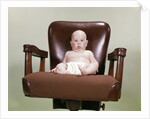 1960s Chubby Bald Baby Wearing Cloth Diaper Sitting In Executive Office Business Chair by Anonymous