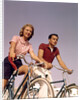 1950s 1960s Couple Man Woman Riding Bicycles Outdoors by Anonymous