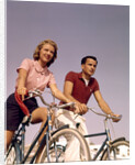 1950s 1960s Couple Man Woman Riding Bicycles Outdoors by Anonymous