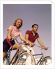 1950s 1960s Couple Man Woman Riding Bicycles Outdoors by Anonymous