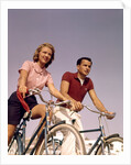 1950s 1960s Couple Man Woman Riding Bicycles Outdoors by Anonymous