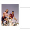 1950s 1960s Couple Man Woman Riding Bicycles Outdoors by Anonymous