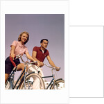 1950s 1960s Couple Man Woman Riding Bicycles Outdoors by Anonymous