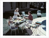 1950s Family In Backyard Having Picnic From Grill Near Swimming Pool by Anonymous