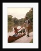 1960s Young Couple Loading Picnic Basket Thermos Into Canoe by Anonymous